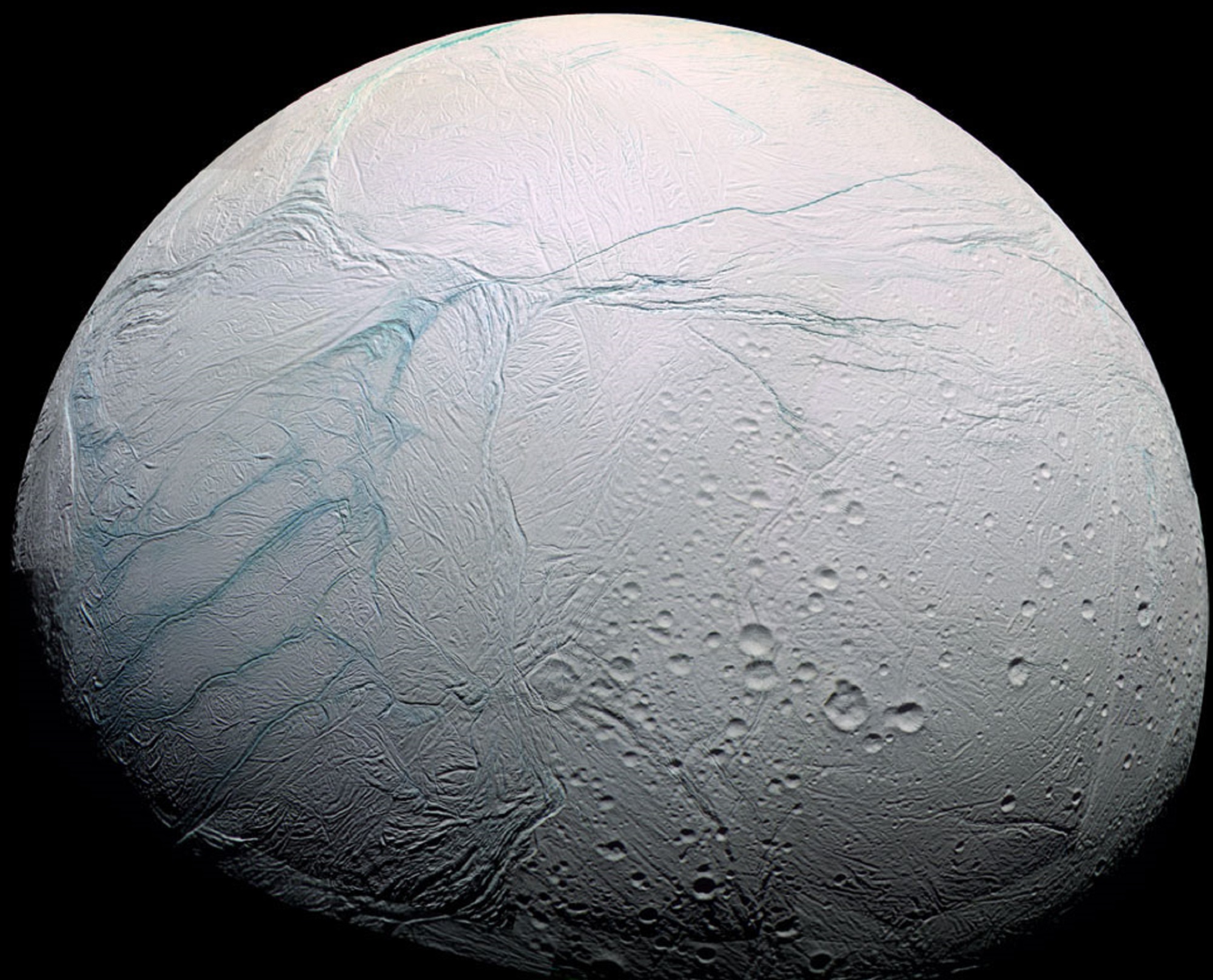 Saturn's ocean moon Enceladus with clear tiger stripes in a blue colorized image from the Cassini space probe