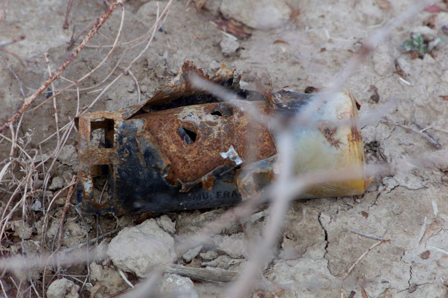 A fragment from a cluster bomb as photographed in 2002 and found near a former Taliban training camp in Afghanistan. 