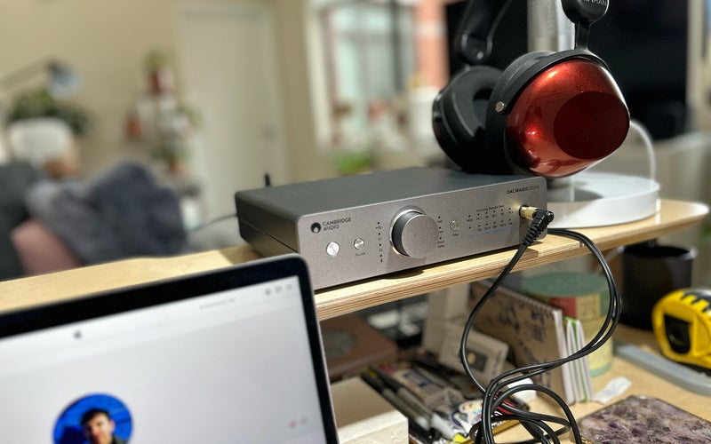 Cambridge Audio DacMagic 200M on a desk with HiFiMAN HE-R9 headphones