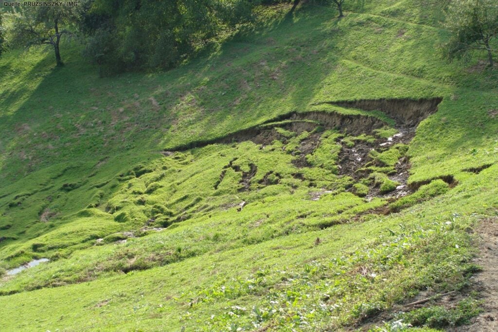 a landslide at the base of a mountain