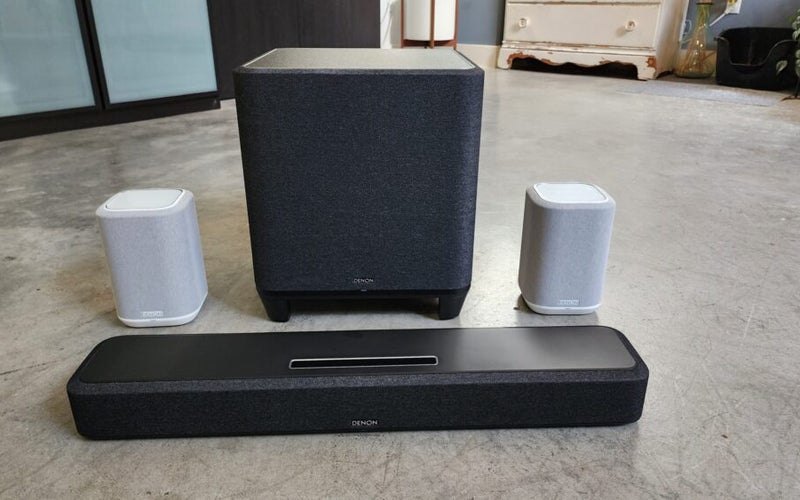 Denon Home Soundbar 550, subwoofer, and 150 speakers on the floor