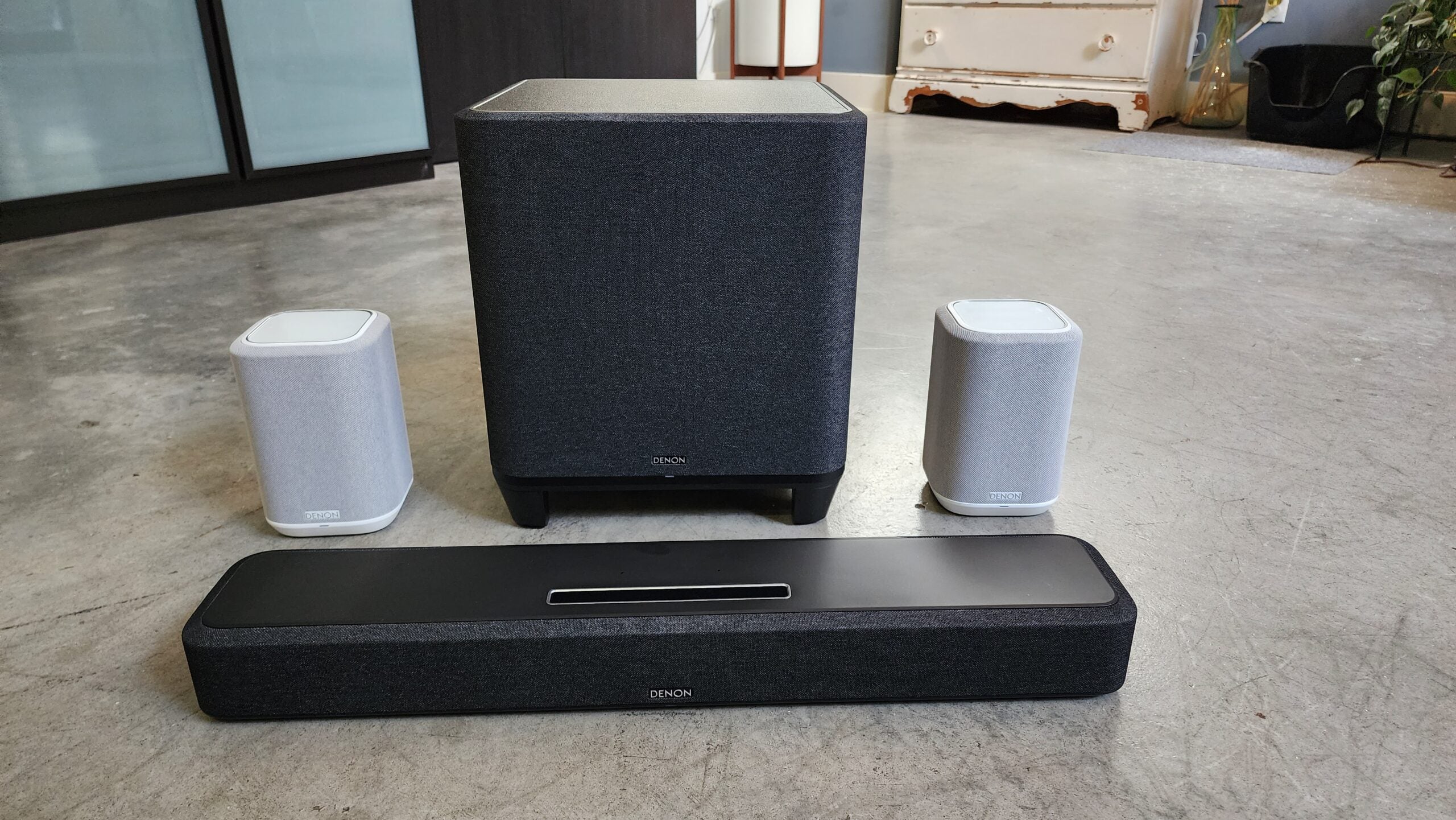 Denon Home Soundbar 550, subwoofer, and 150 speakers on the floor