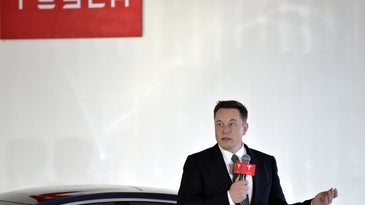 Tesla CEO Elon Musk speaks during a press conference