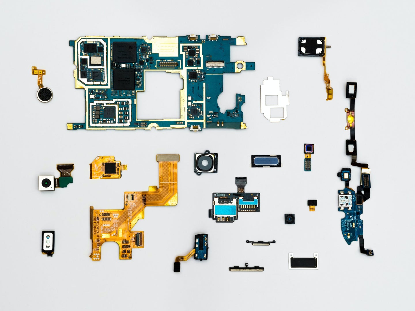 parts of an electronic device laid out flat