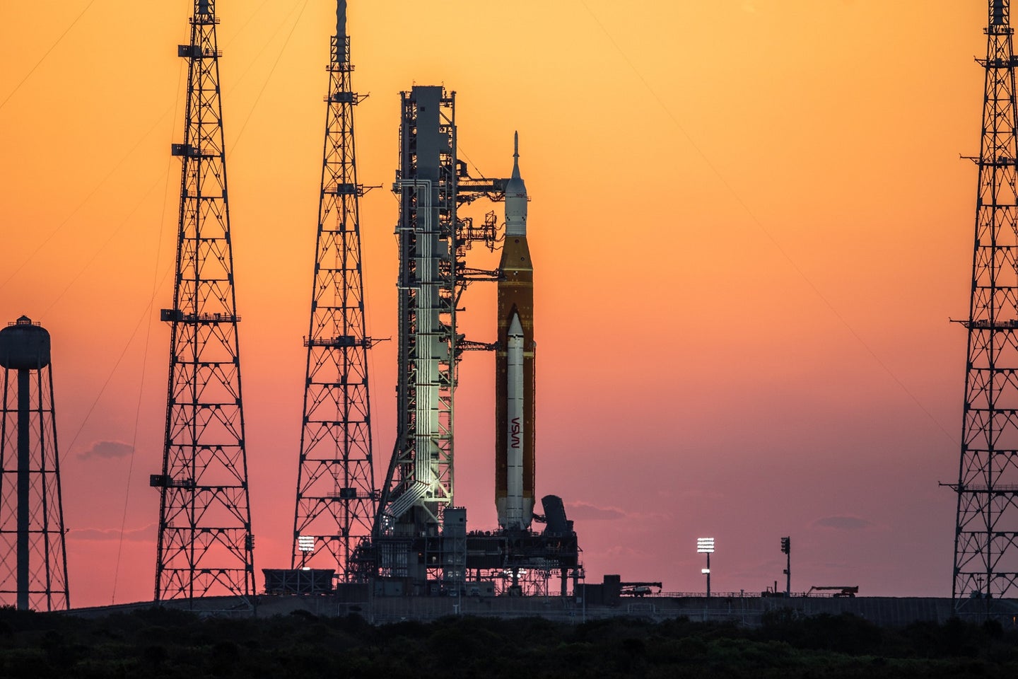 NASA SLS rocket against sunset at Kennedy Space Center launch pad before Artemis I mission