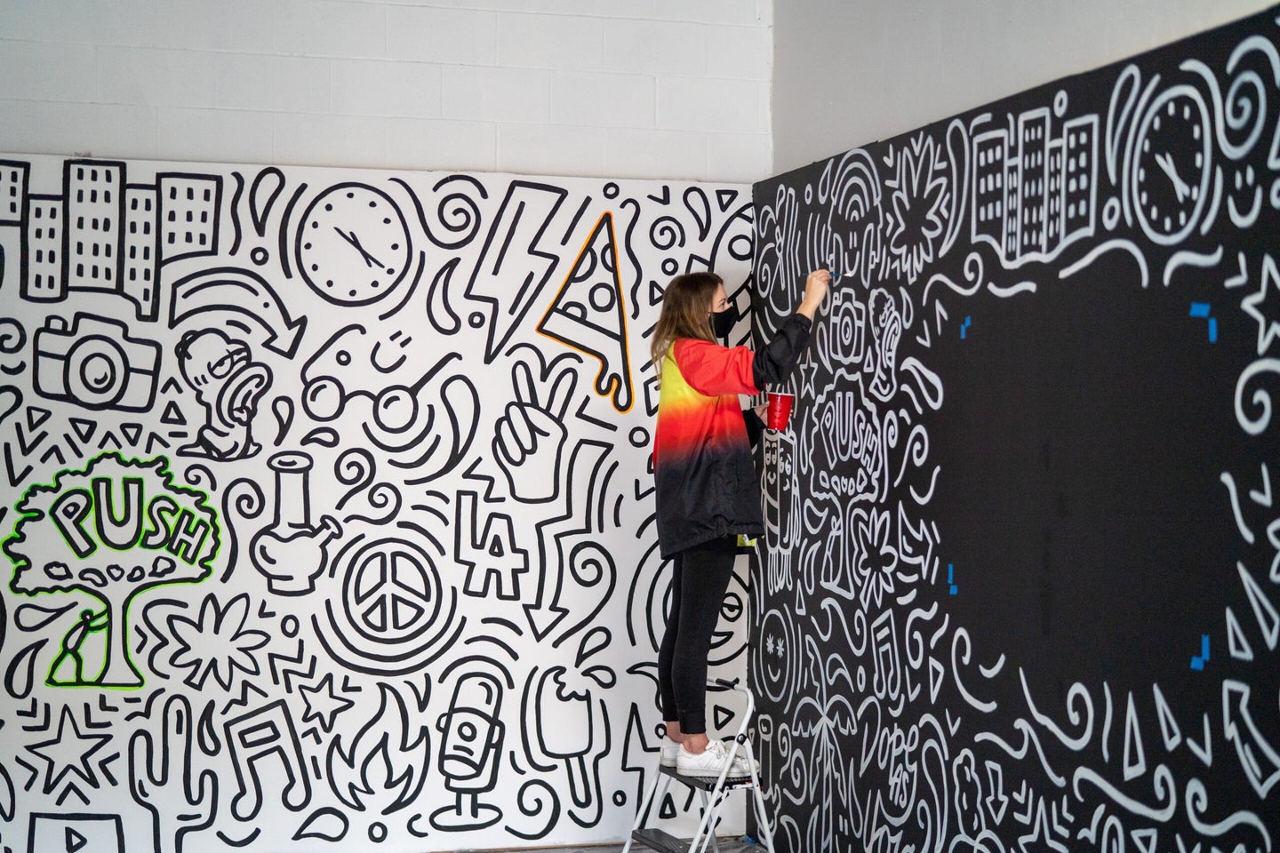 woman painting patterns on wall viral creativity test header image
