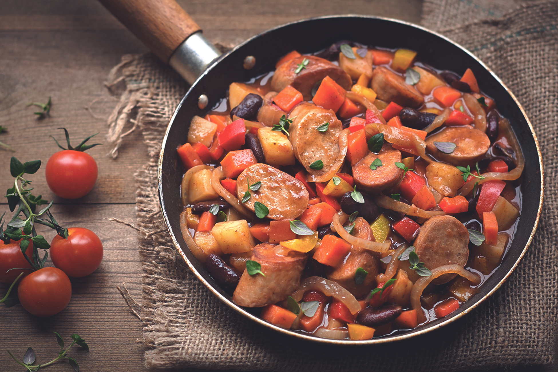 Quorn sausage and bean stew in a skillet.