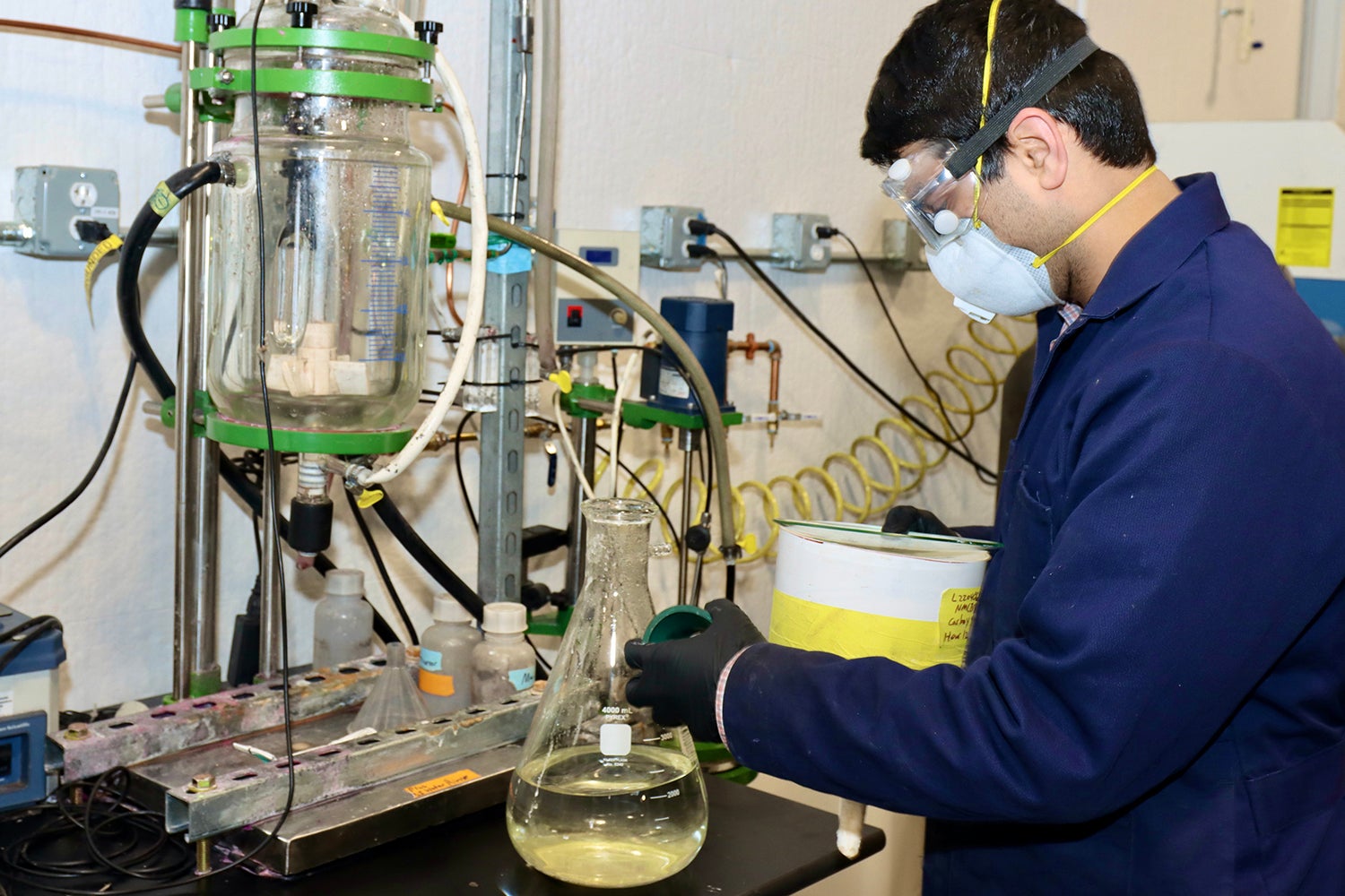 Scientist checks liquid for metals