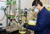 Scientist checks liquid for metals