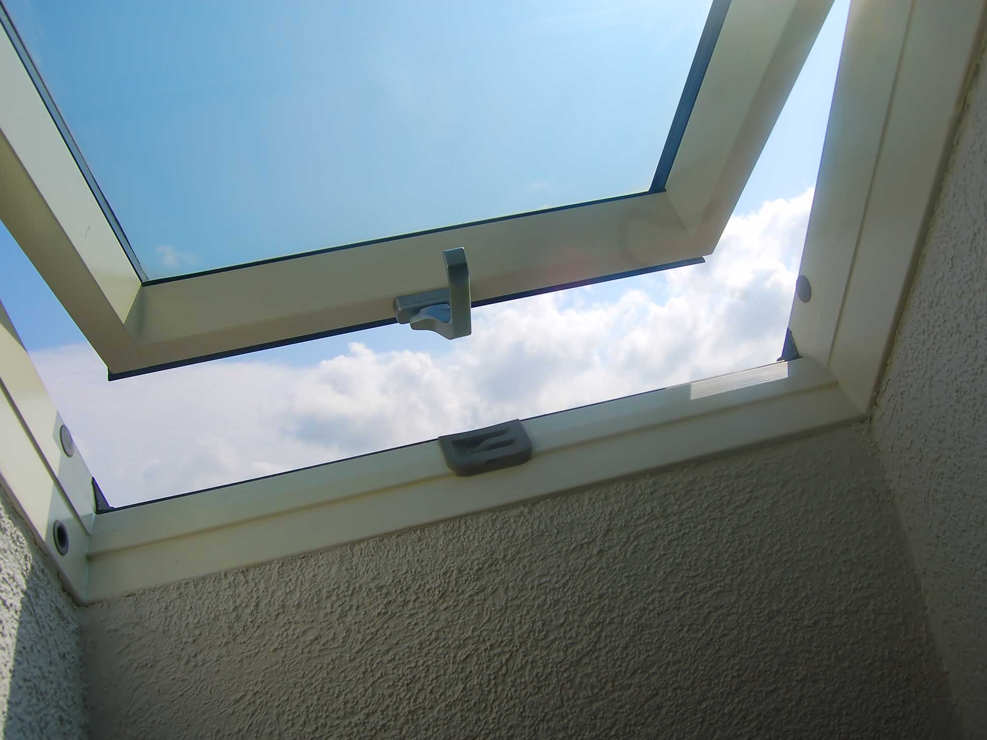 A photo of an open window, skylight.
