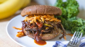 A vegan pulled pork sandwich made with shredded banana peels covered in homemade barbecue sauce.
