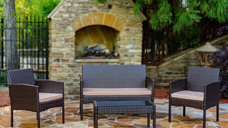 A photo of the Lark Manor Wicker Set on an outdoor patio