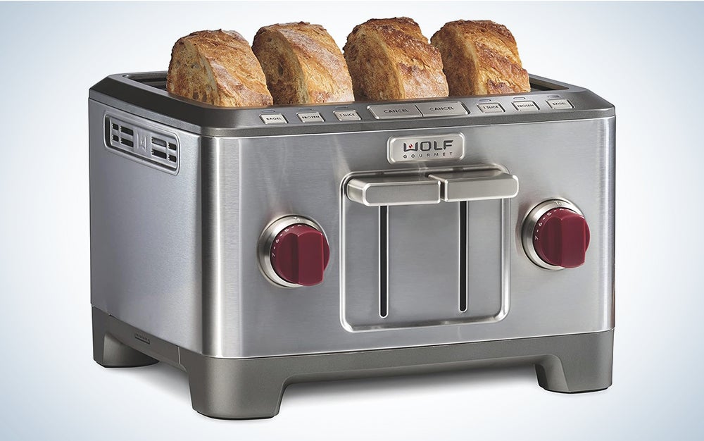 Silver Wolf Gourmet 4 slice toaster with red knobs and thick sliced bread in the slots