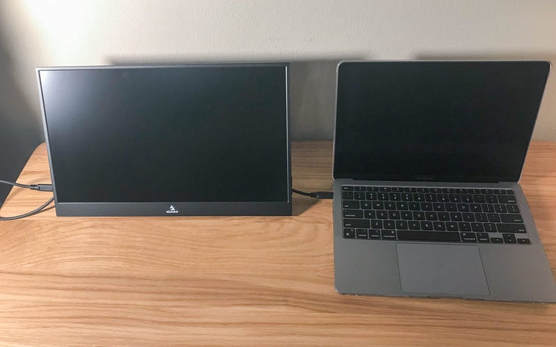 Nexigo 17.3â 300Hz portable monitor on a desk connected to a Mac laptop