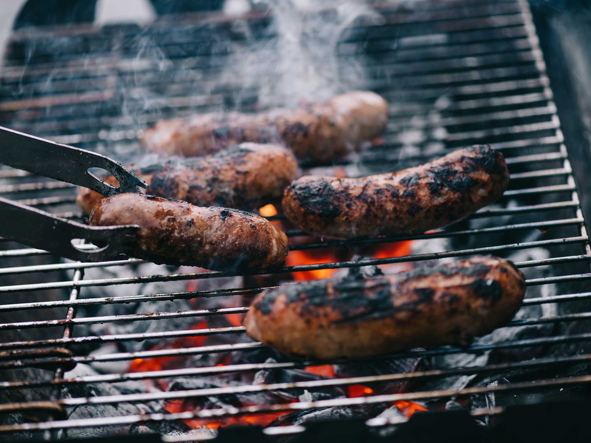 Photo of sausages on the grill.