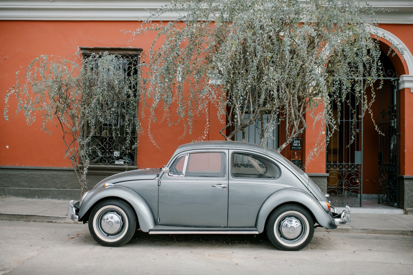Vintage VW bug parked on the street.