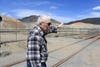 Ed Banderob, with the Greeley Neighborhood Community Development Corporation Inc., walks near the Continental mine in Butte, Montana. Banderob and some other residents of the neighborhood across the street are concerned the dust from the mine is polluting the air. (Katheryn Houghton/KHN)