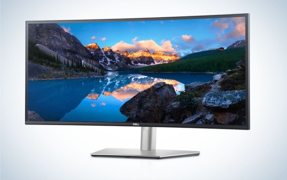A Dell curved monitor with a landscape screensaver helps professional productivity