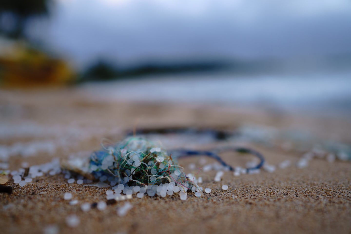 Microplastic pellets on the beach.