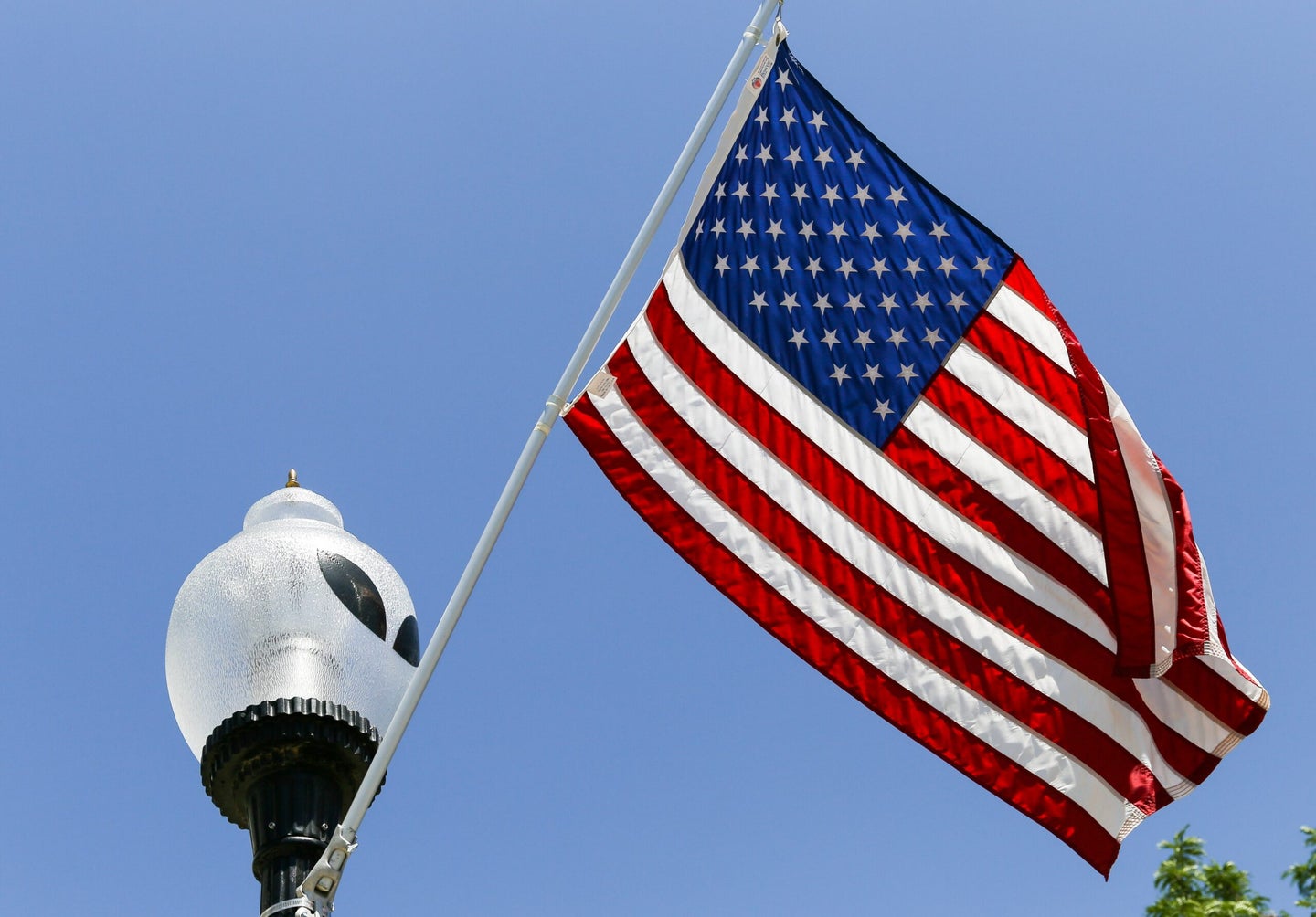 American flag suspended from an alien pole to signify recent UAP investigations by NASA and the DOD