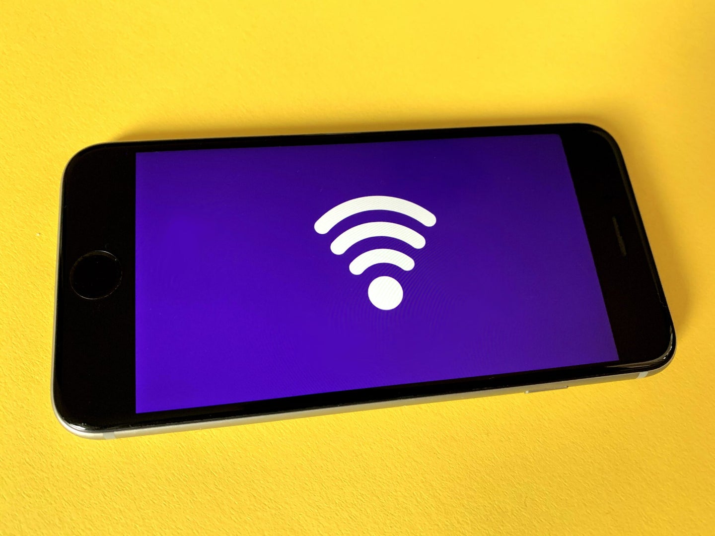 Wi-Fi logo on a phone Best hotspot plans feature image