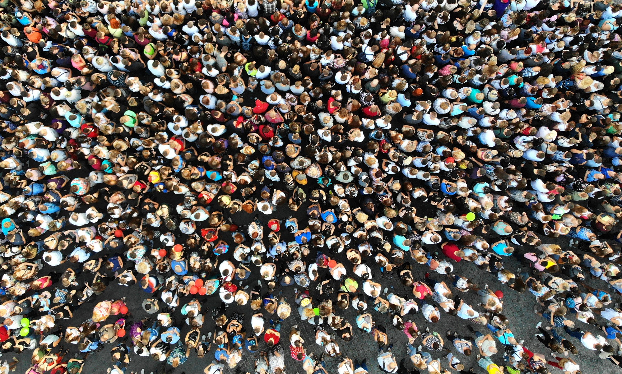 Crowd of people seen from above to represent 2022 global population estimate