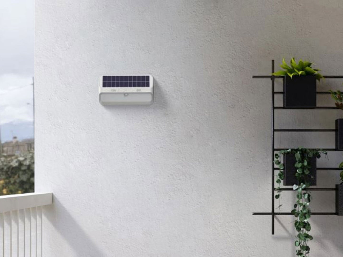 An outdoor solar charging light mounted on a wall
