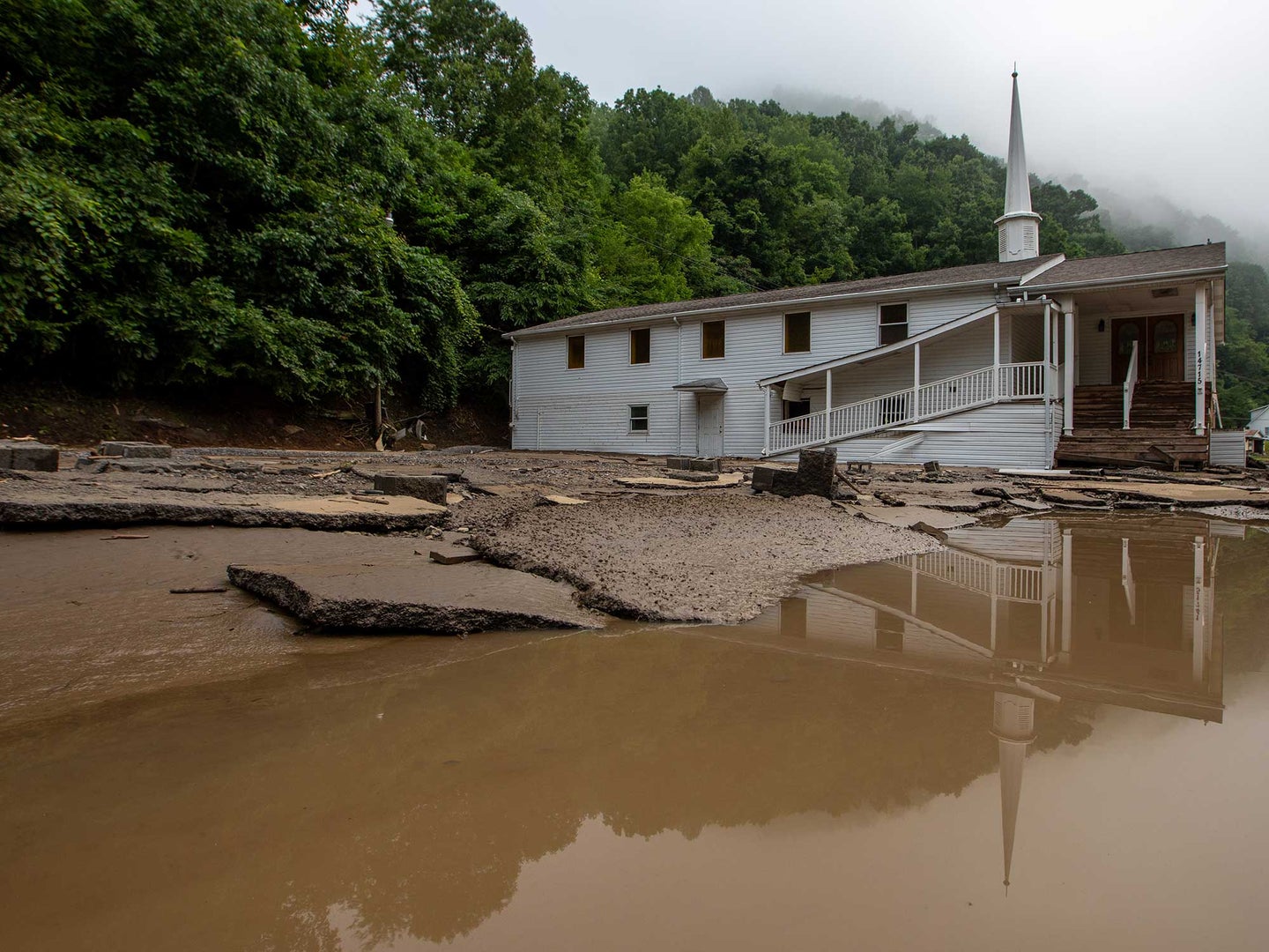 A view of damage after a severe storm hit the area located in the state's southwest region, bringing heavy rain and flooding in Buchanan County, United States on July 14, 2022. Seventeen people are missing in flooding and it also damaged more than 100 homes and caused power outages. 