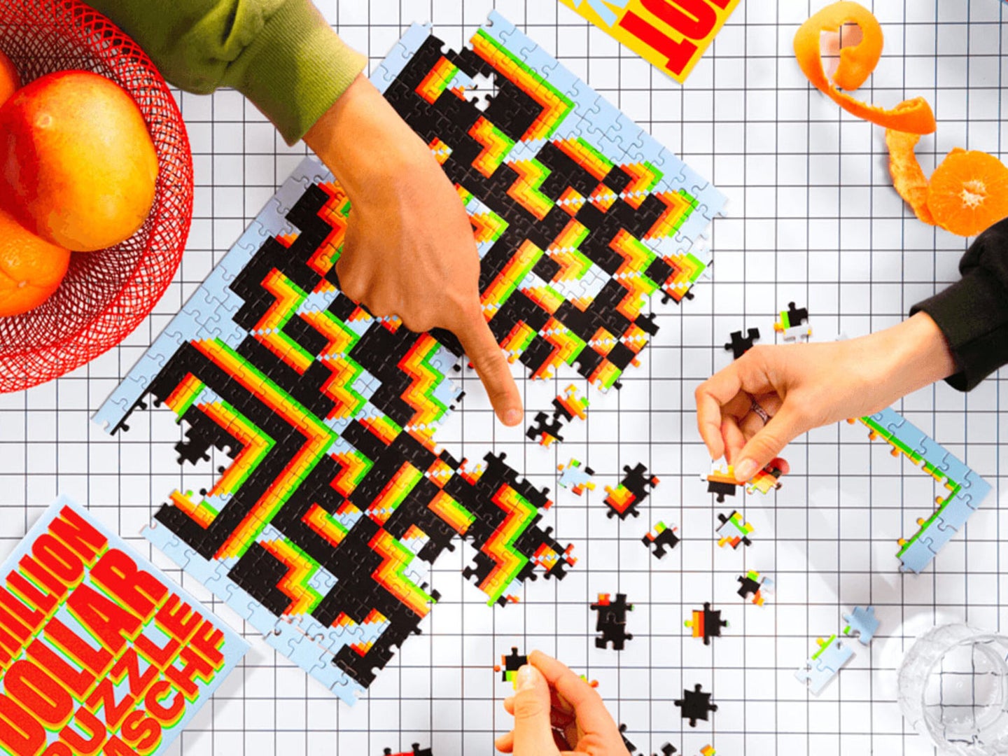 Two people completing a puzzle