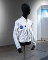 White NASA Apollo 11 flight jacket on a black mannequin
