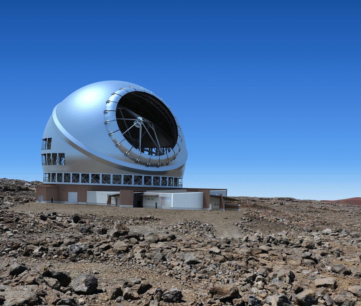 an artist rendering of a sphere-shaped large telescope facility in a rocky terrain