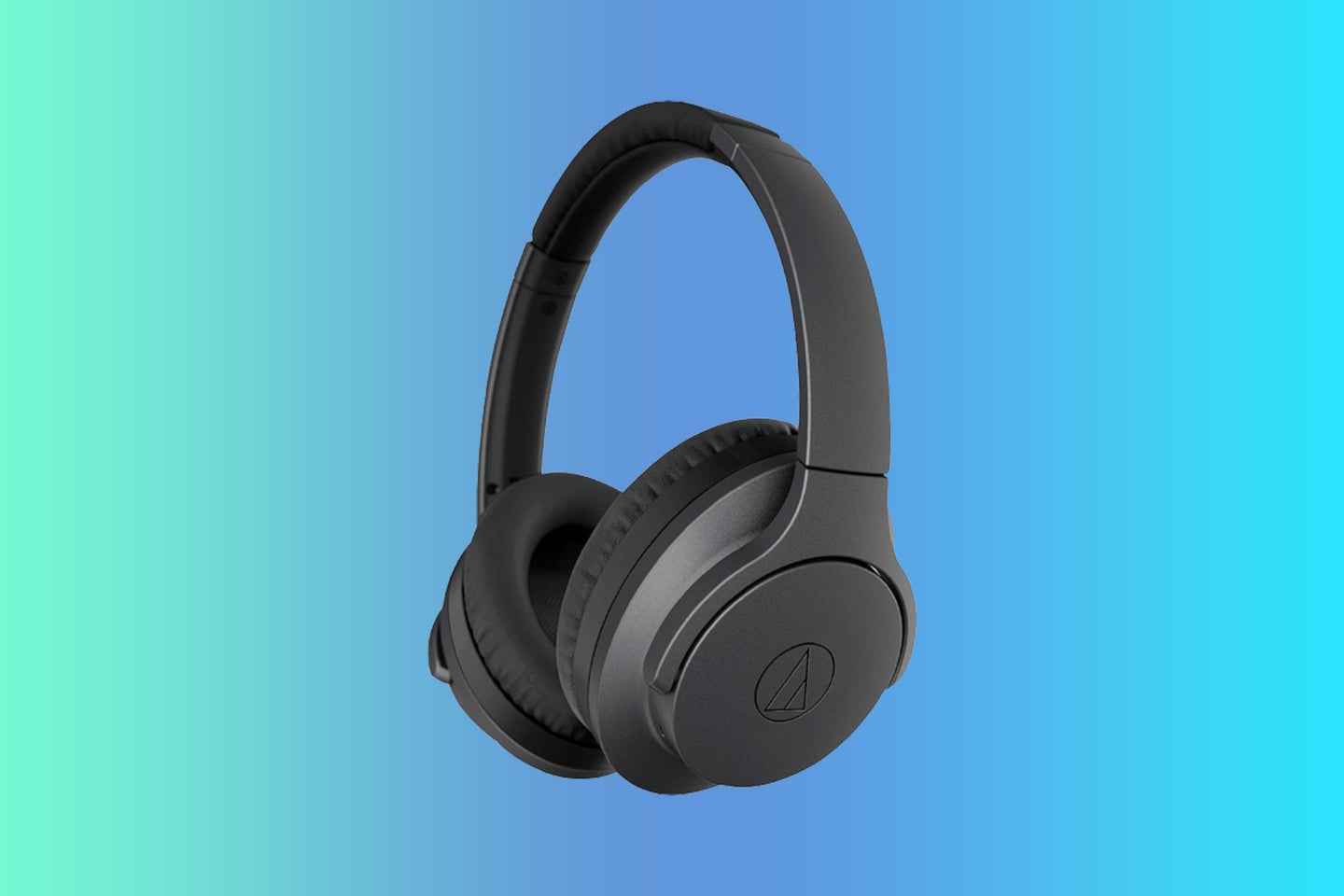 A pair of black wireless headphones on a blue gradient background