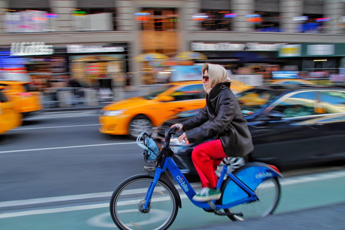 woman biking on citi bike in NYC