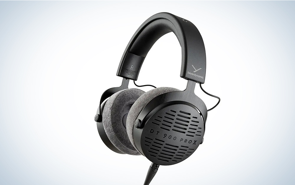 A black pair of beyerdynamic headphones on a blue and white gradient background