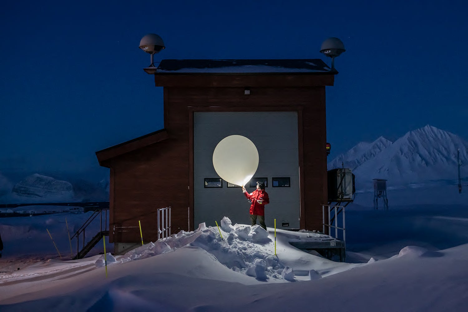 Scientist releases weather balloon at night