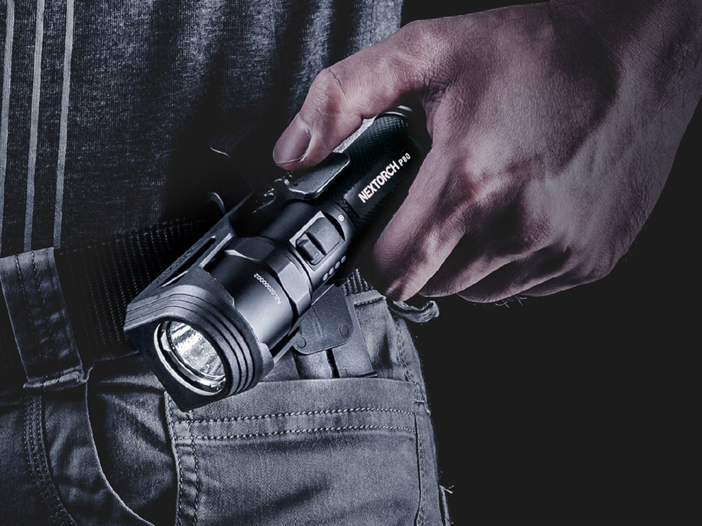 A person putting a bright flashlight into their pocket