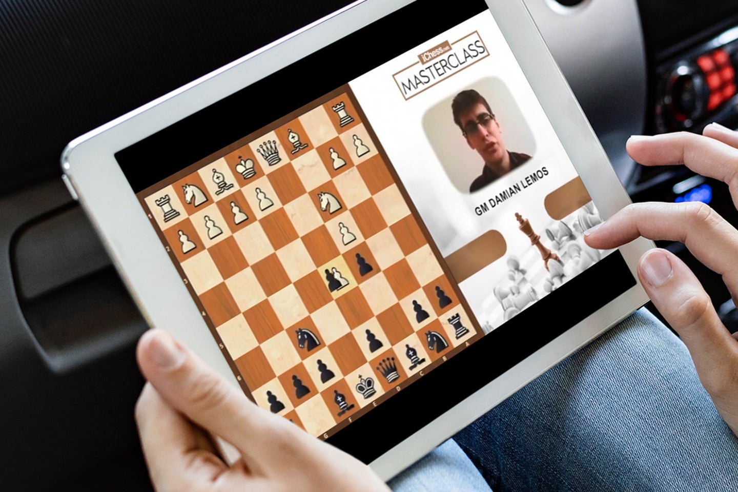 A person playing chess on an iPad
