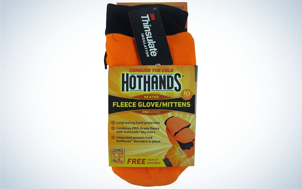 A pair of orange and black Hot Hands Heated Fleece Glove/Mittens on a plain background