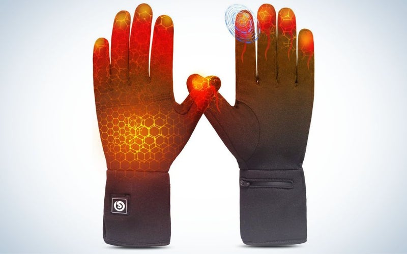 A pair of black Sun Will Heated Glove Liners on a plain blue background
