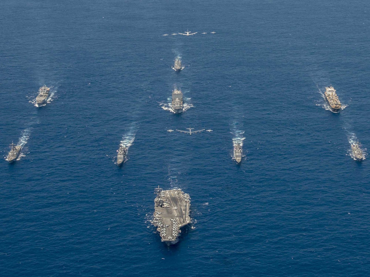 Ships from Standing NATO Maritime Group 2, the Nimitz-class aircraft carrier USS Harry S. Truman (CVN 75), the Arleigh Burke-class guided missile destroyer USS Cole (DDG 67) and Italian Navy Carlo Bergamini-class frigate ITS Alpino (F594) sail in formation in the Mediterranean Sea, July 24, 2022.