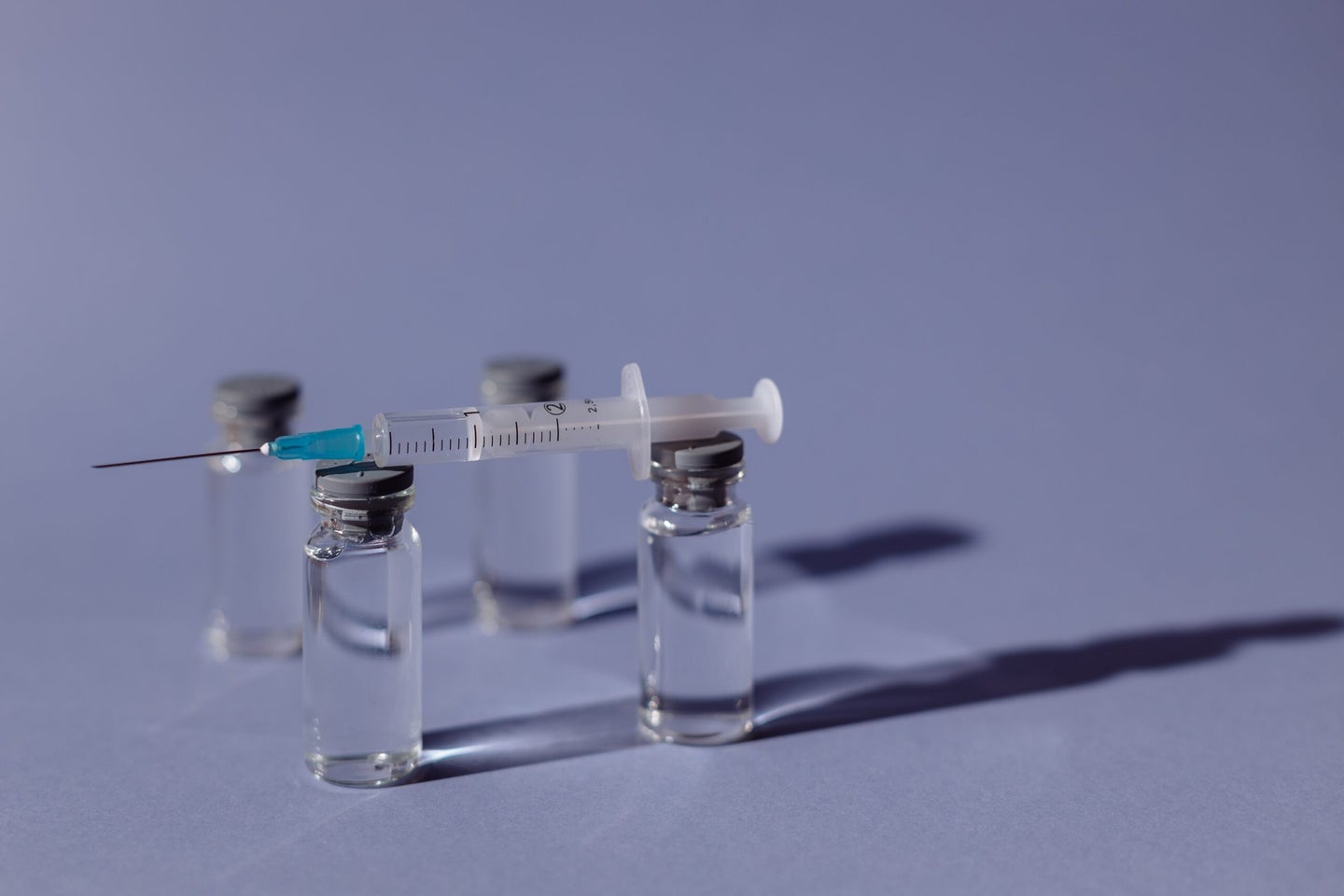 Vials of vaccine with needle