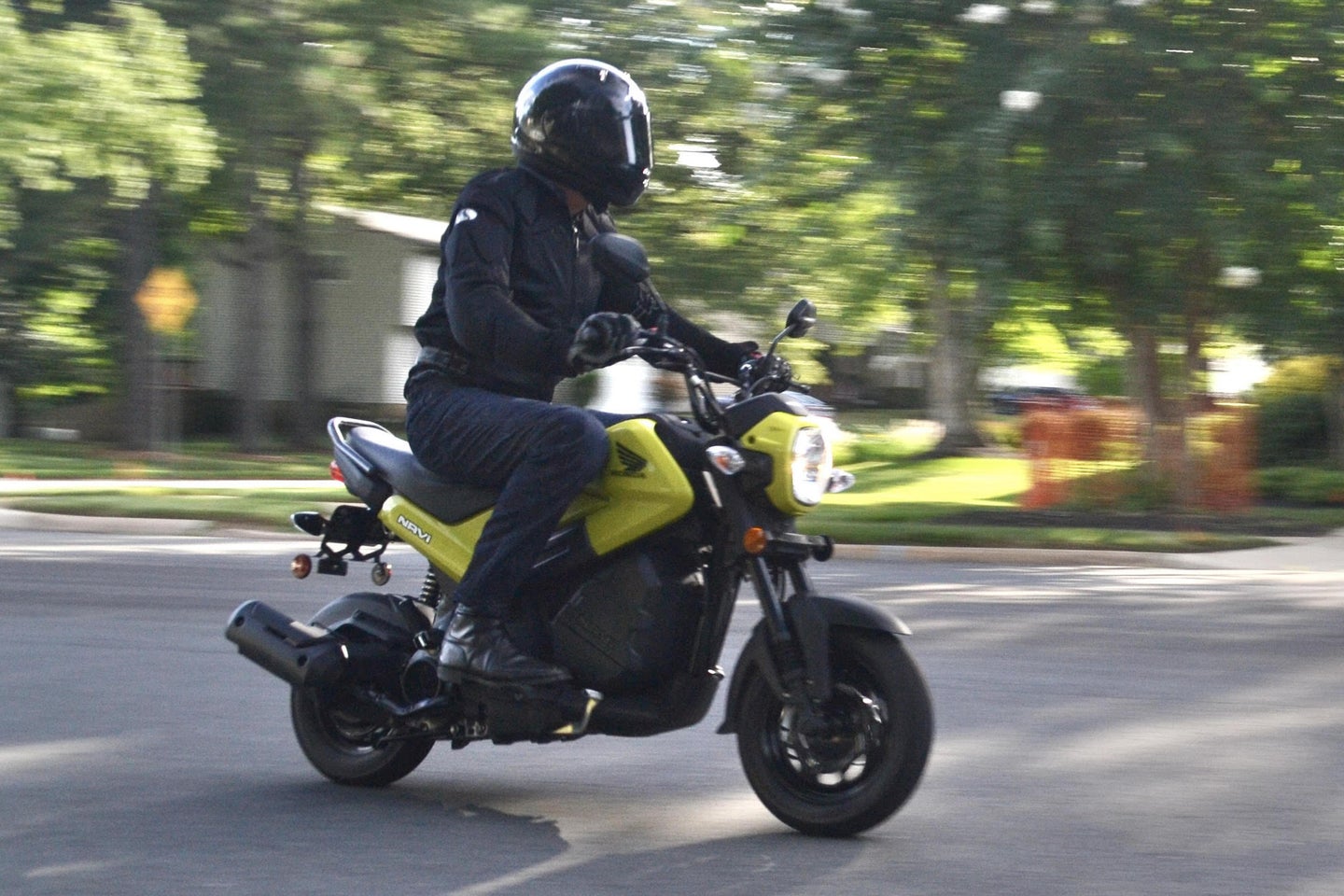 a rider on a small Honda motorcycle