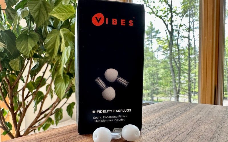Vibes earplugs in front of a plant