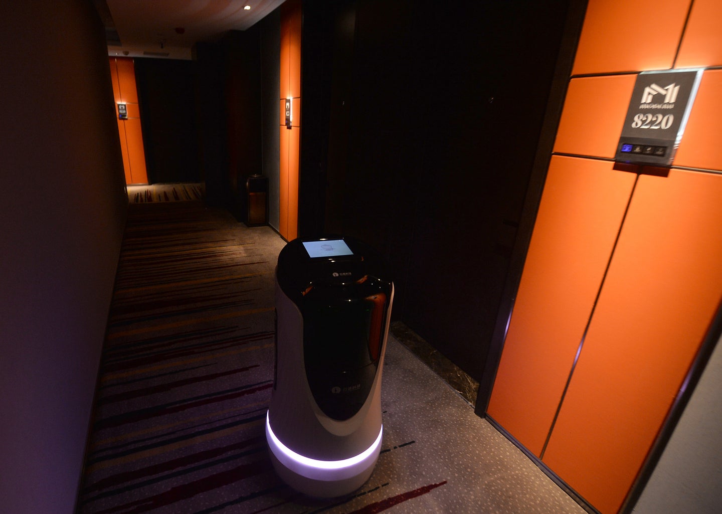 a robot moving along the corridors of a hotel