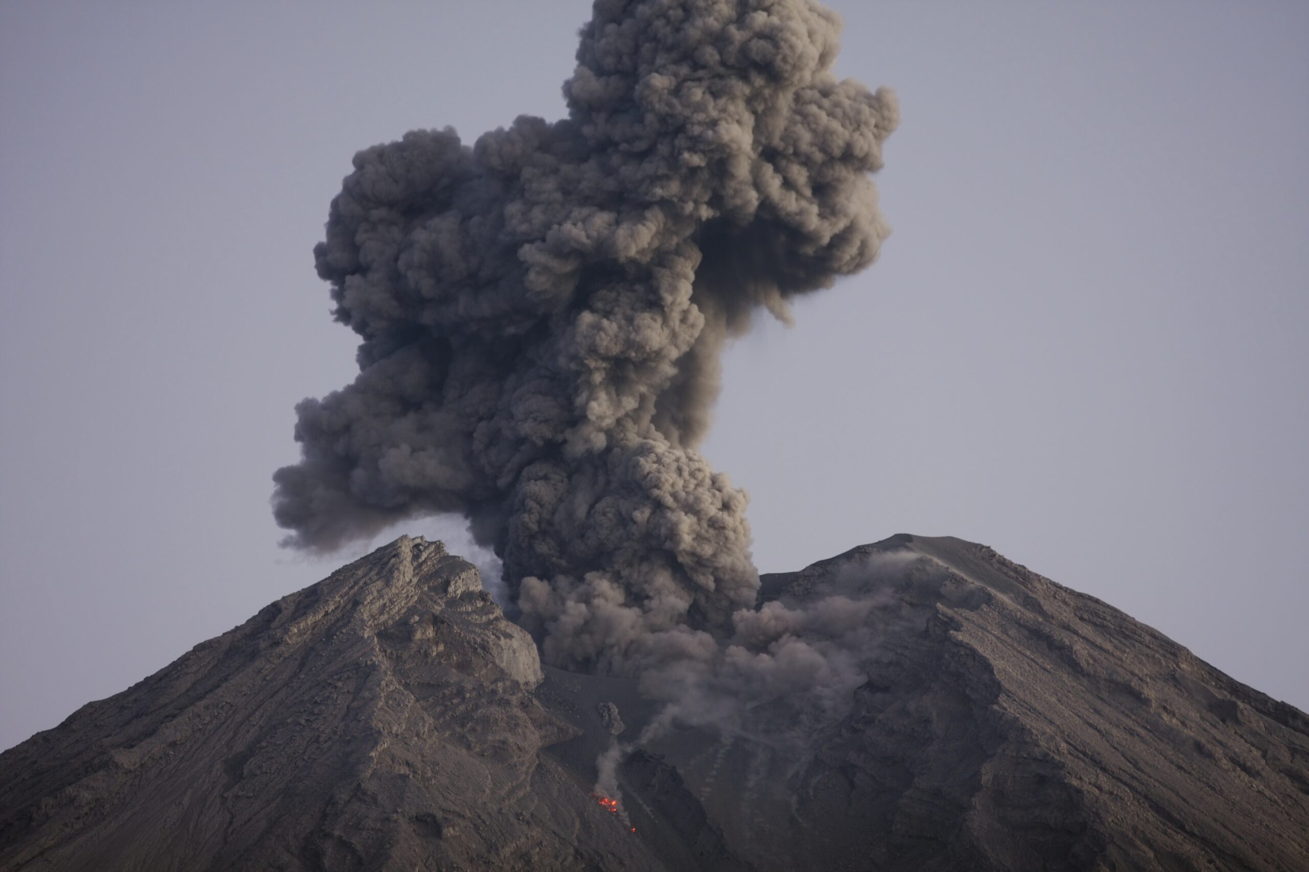 A cloud of deadly volcanic ash spews from a volcano.