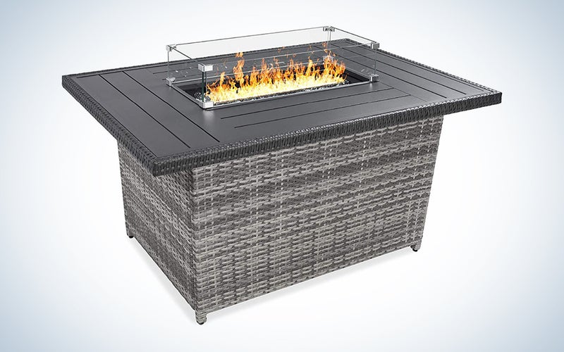 A fire pit table against a blue and white background