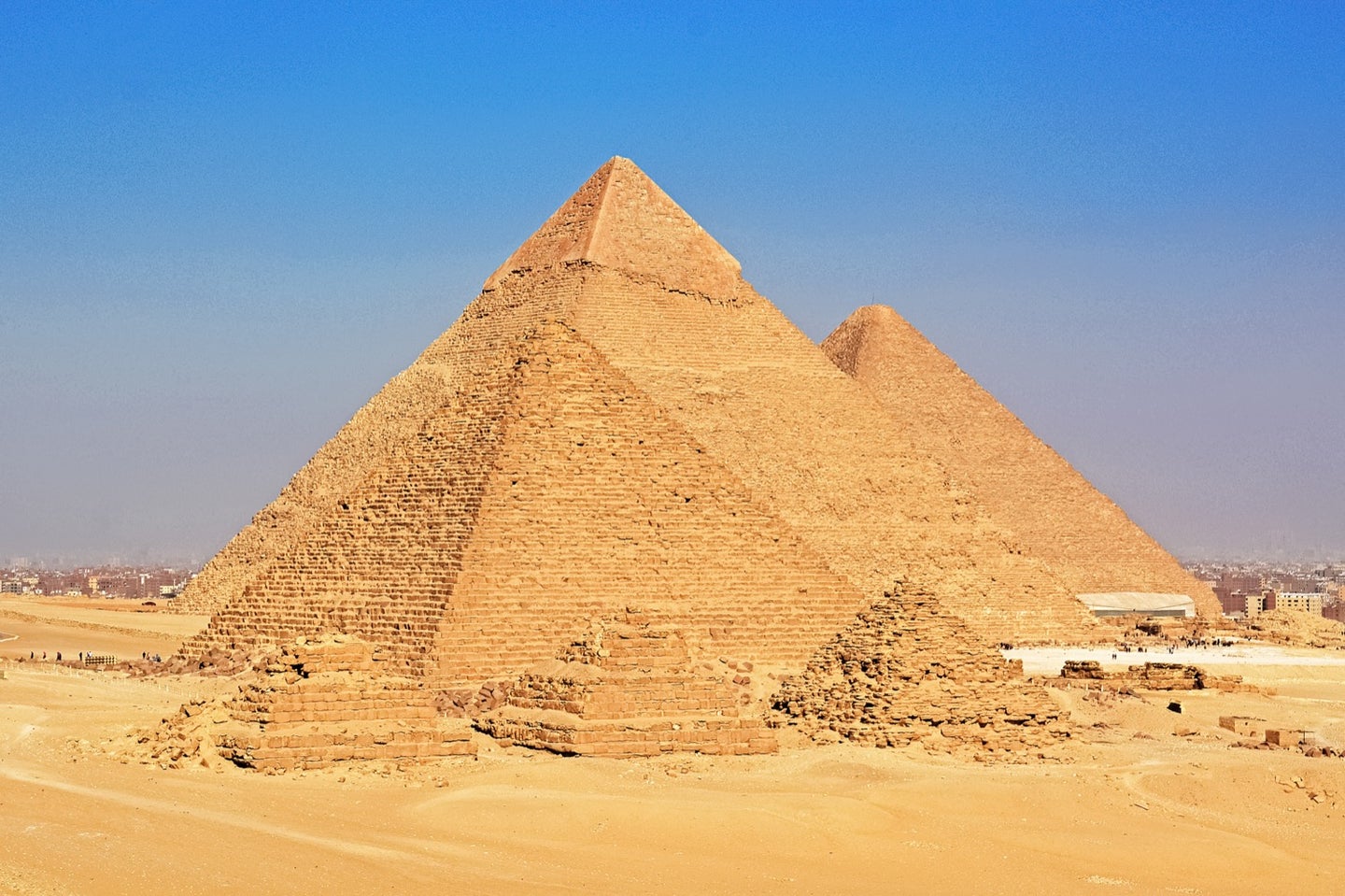 the three pyramids of giza under a sunny day