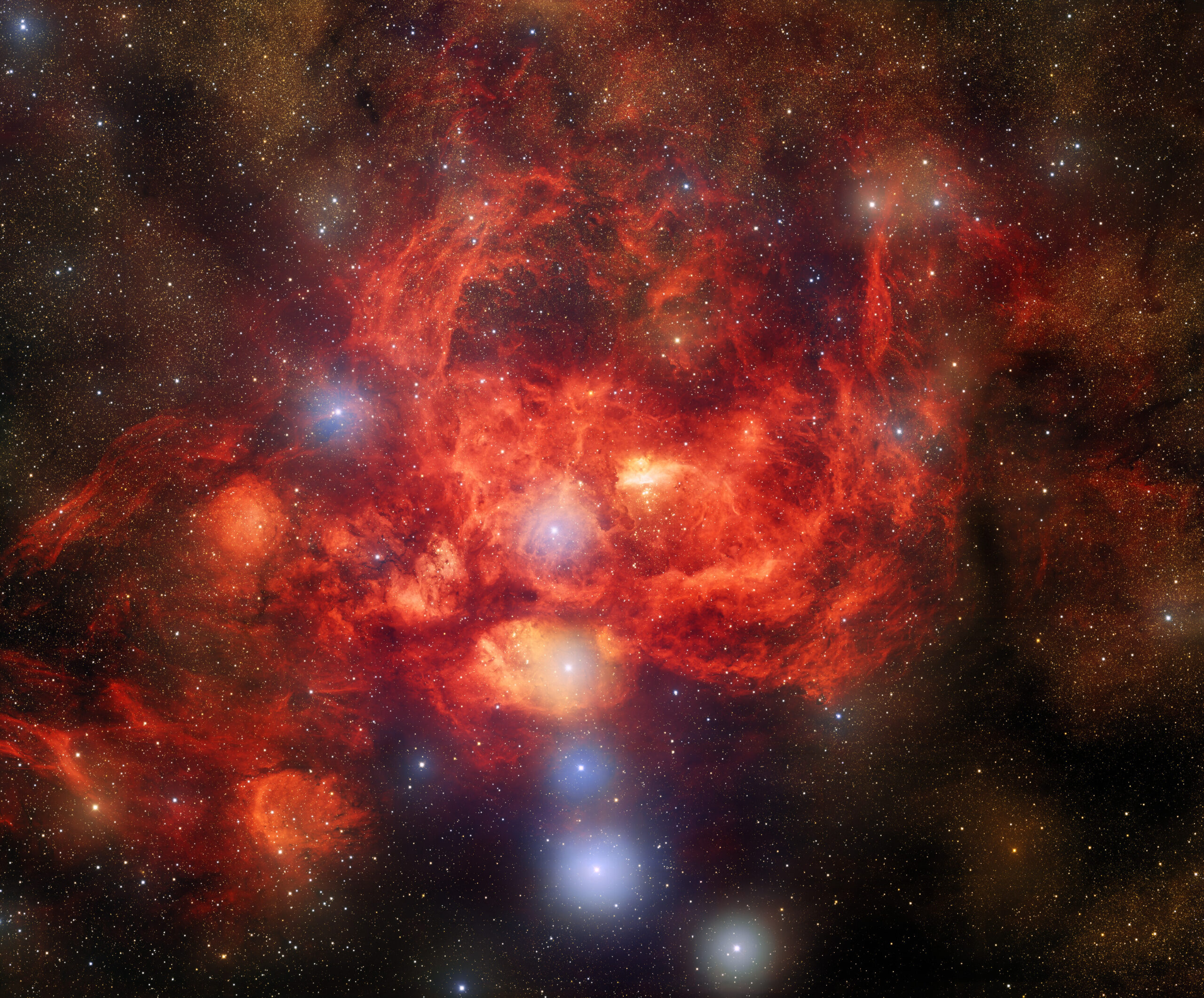 Bright, young stars surrounded by billowing clouds of dust and gas inside the Lobster Nebula. 