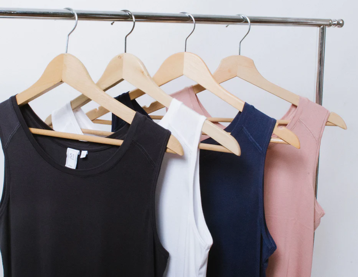 a clothing rank of tank tops
