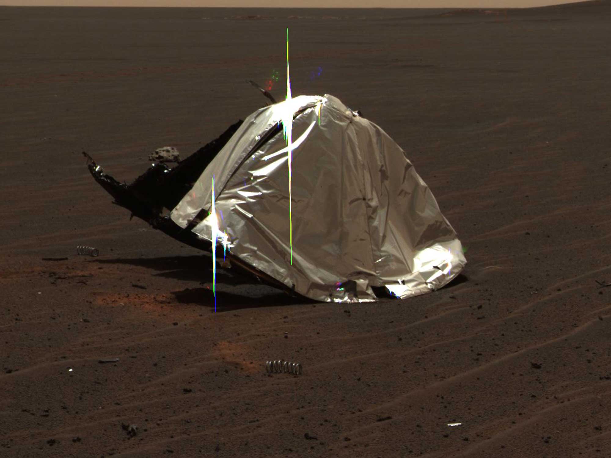 Rovers on Mars frequently come across debris–like this heat shield and spring–from their own or other missions.